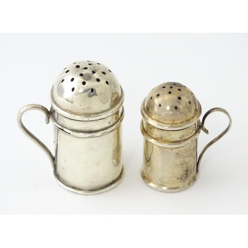 615 - Two small novelty silver pepperettes of flour shaker form, one Victorian example hallmarked Birmingh... 