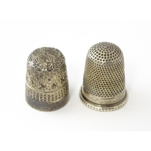 616 - A Victorian silver thimble hallmarked Chester 1897, maker Deakin & Francis. Together with a DORCAS C... 