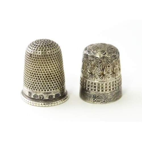 616 - A Victorian silver thimble hallmarked Chester 1897, maker Deakin & Francis. Together with a DORCAS C... 