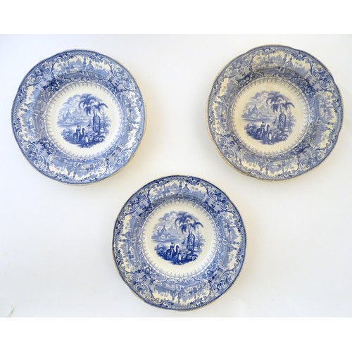 90 - A 19thC blue and white meat plate / platter, together with three matching soup bowls decorated with ... 