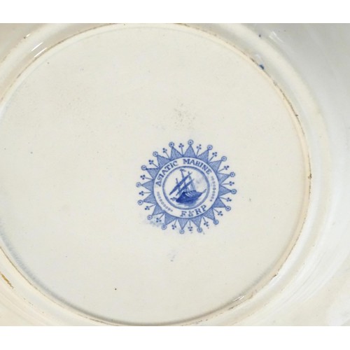 90 - A 19thC blue and white meat plate / platter, together with three matching soup bowls decorated with ... 