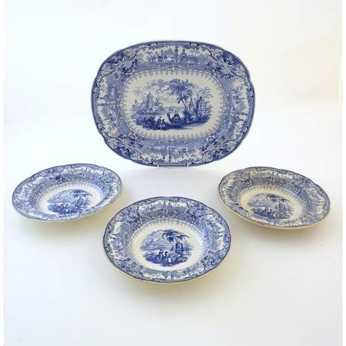 90 - A 19thC blue and white meat plate / platter, together with three matching soup bowls decorated with ... 