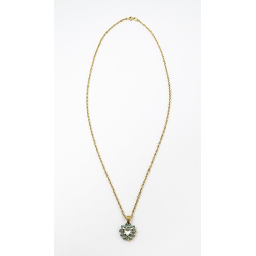 820 - A 9ct gold pendant set with white and aqua coloured stones, with chain necklace. The chain approx 20... 