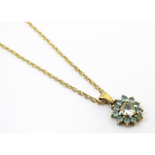 820 - A 9ct gold pendant set with white and aqua coloured stones, with chain necklace. The chain approx 20... 