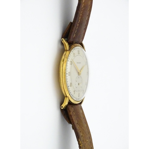 1028 - An 18ct gold cased gentleman's Movado wristwatch the silvered dial with Arabic numerals and subsidia... 