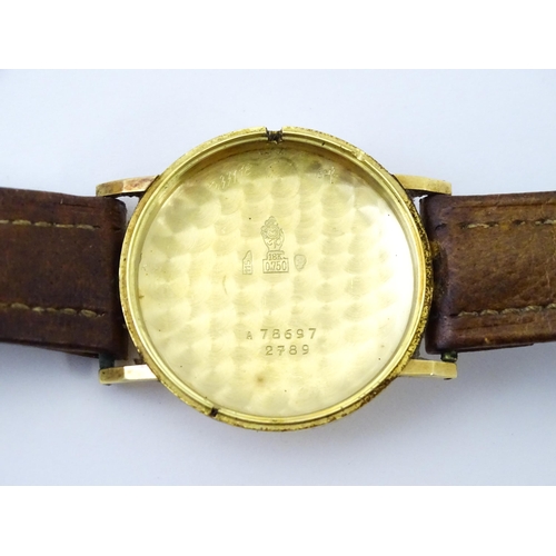 1028 - An 18ct gold cased gentleman's Movado wristwatch the silvered dial with Arabic numerals and subsidia... 
