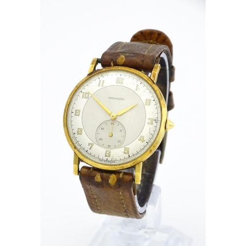 1028 - An 18ct gold cased gentleman's Movado wristwatch the silvered dial with Arabic numerals and subsidia... 