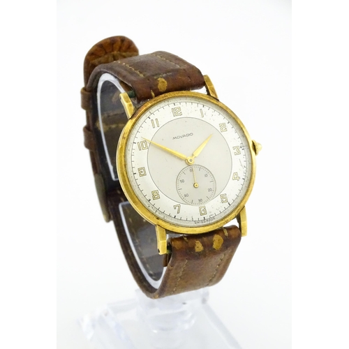 1028 - An 18ct gold cased gentleman's Movado wristwatch the silvered dial with Arabic numerals and subsidia... 