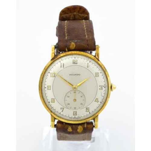 1028 - An 18ct gold cased gentleman's Movado wristwatch the silvered dial with Arabic numerals and subsidia... 