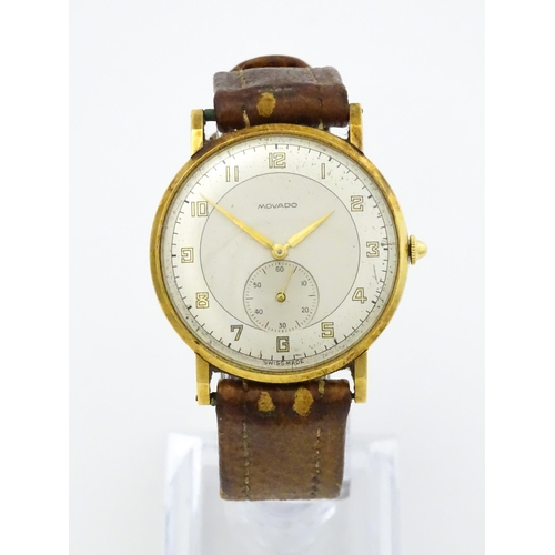 1028 - An 18ct gold cased gentleman's Movado wristwatch the silvered dial with Arabic numerals and subsidia... 