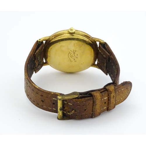 1028 - An 18ct gold cased gentleman's Movado wristwatch the silvered dial with Arabic numerals and subsidia... 