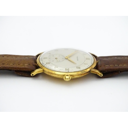 1028 - An 18ct gold cased gentleman's Movado wristwatch the silvered dial with Arabic numerals and subsidia... 