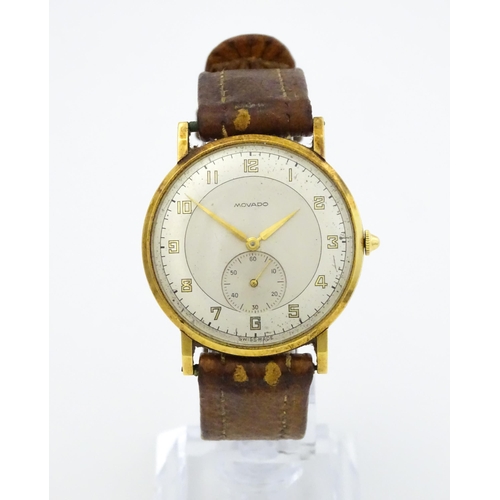 1028 - An 18ct gold cased gentleman's Movado wristwatch the silvered dial with Arabic numerals and subsidia... 