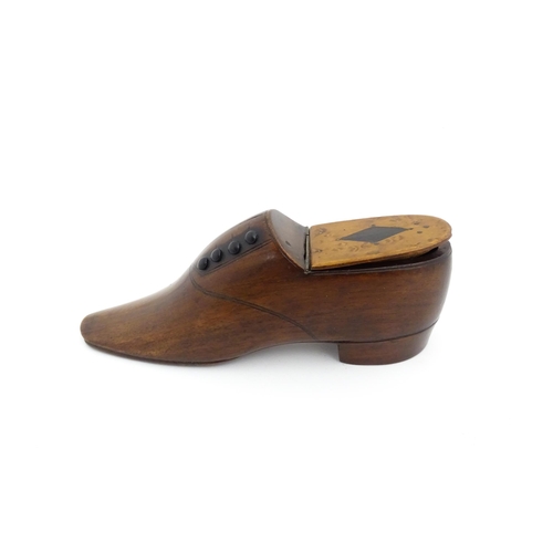 1347 - Treen : A late 19th / early 20thC table shoe snuff box with incised and button detail, the hinged li... 