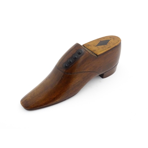 1347 - Treen : A late 19th / early 20thC table shoe snuff box with incised and button detail, the hinged li... 