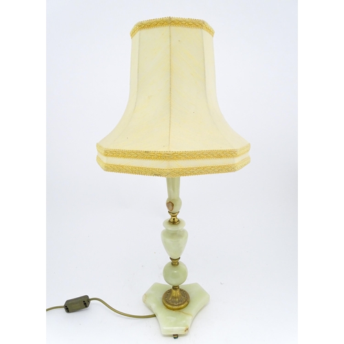 1672 - A 20thC table lamp with onyx style turned base. Approx. 18