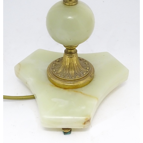 1672 - A 20thC table lamp with onyx style turned base. Approx. 18