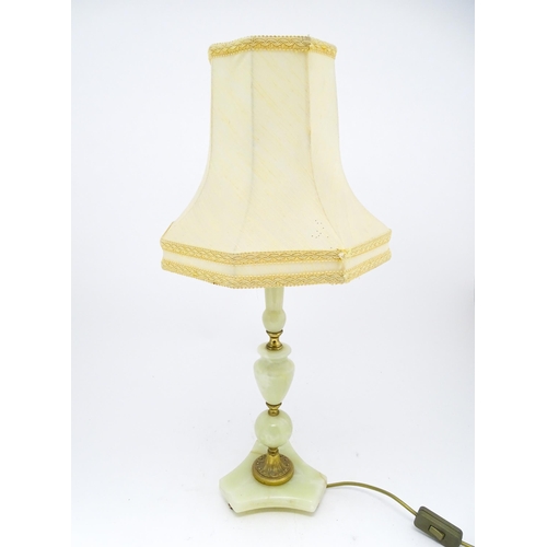 1672 - A 20thC table lamp with onyx style turned base. Approx. 18