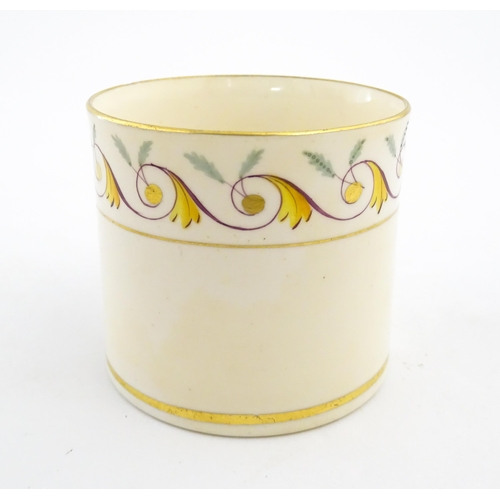 102 - An English 19thC coffee cup with yellow, green and gilt banded detail. Approx. 2