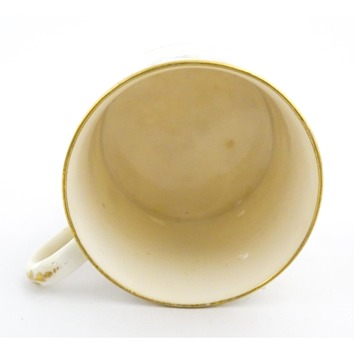 102 - An English 19thC coffee cup with yellow, green and gilt banded detail. Approx. 2