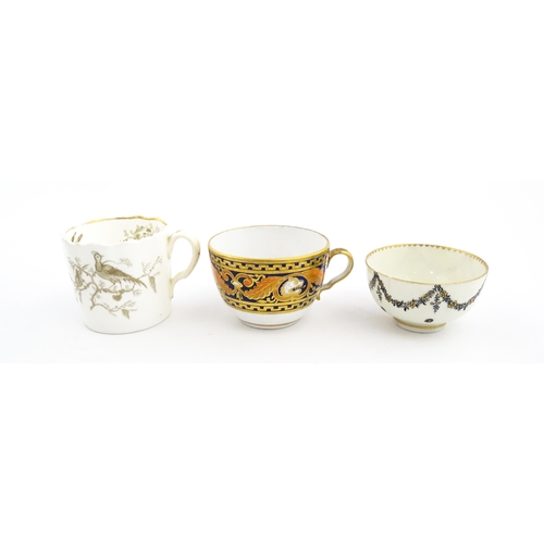 107 - Two 19thC tea cups comprising one with banded foliate and lion mask detail, and another with bird de... 