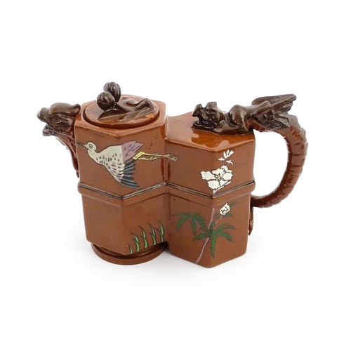 108 - A Watcombe pottery terracotta Aesthetic Movement teapot designed by Christopher Dresser with dragon ... 