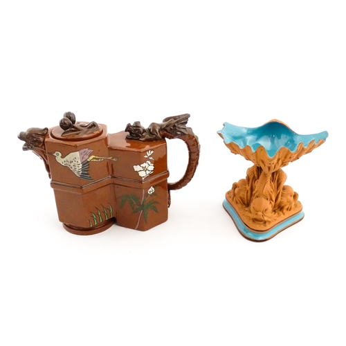 108 - A Watcombe pottery terracotta Aesthetic Movement teapot designed by Christopher Dresser with dragon ... 