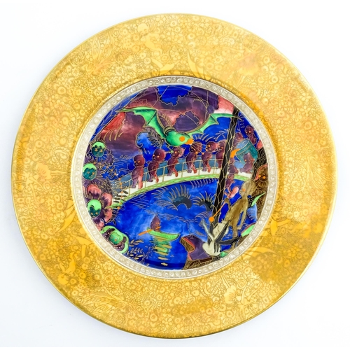 133 - A Wedgwood Fairyland lustre plate decorated in the Imps on a Bridge - Roc Centre pattern, designed b... 