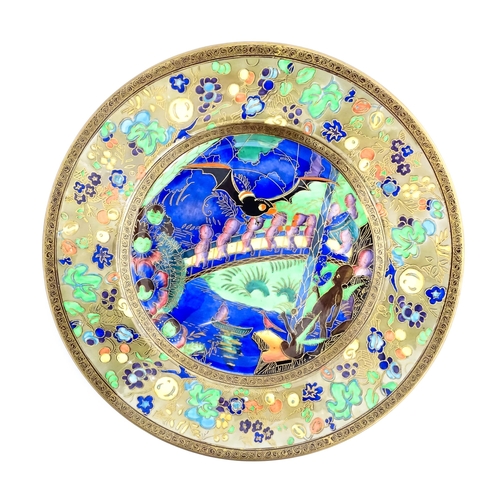 132 - A Wedgwood Fairyland lustre plate decorated in the Imps on a Bridge - Roc Centre pattern, designed b... 