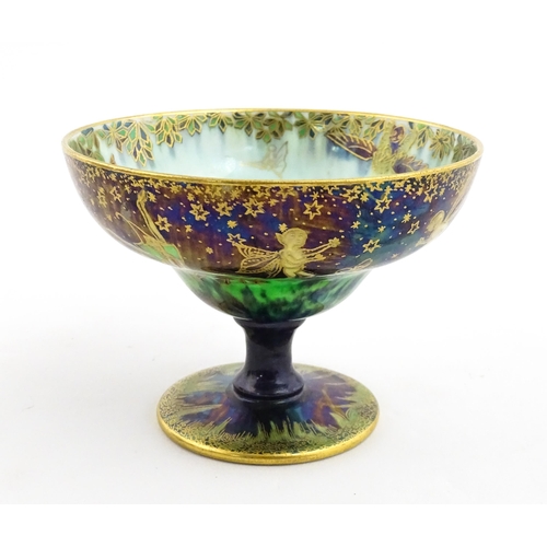 135 - A Wedgwood fairyland lustre pedestal bowl decorated with fairies, elves and imps, designed by Daisy ... 