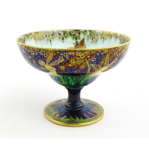 135 - A Wedgwood fairyland lustre pedestal bowl decorated with fairies, elves and imps, designed by Daisy ... 