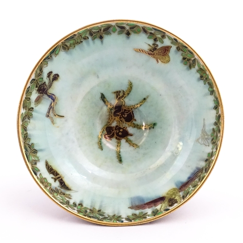 135 - A Wedgwood fairyland lustre pedestal bowl decorated with fairies, elves and imps, designed by Daisy ... 