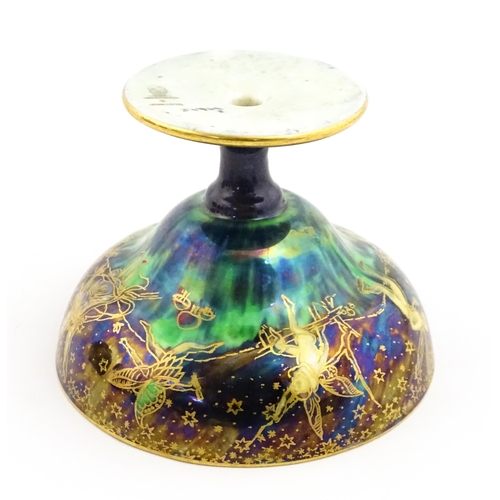 135 - A Wedgwood fairyland lustre pedestal bowl decorated with fairies, elves and imps, designed by Daisy ... 