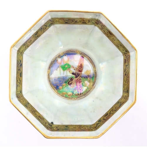 136 - A Wedgwood Fairyland lustre octagonal bowl decorated in the Red Firbolgs pattern, designed by Daisy ... 