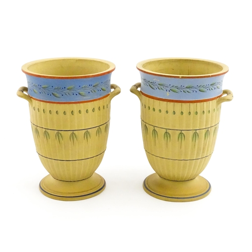 139 - A pair of early Wedgwood caneware vases, the fluted bodies with twin handles and banded foliate deco... 