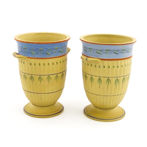 139 - A pair of early Wedgwood caneware vases, the fluted bodies with twin handles and banded foliate deco... 