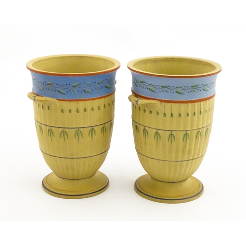 139 - A pair of early Wedgwood caneware vases, the fluted bodies with twin handles and banded foliate deco... 