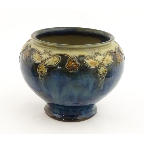 141 - A Royal Doulton stoneware vase / planter decorated with tube lined floral garlands. Marked under and... 