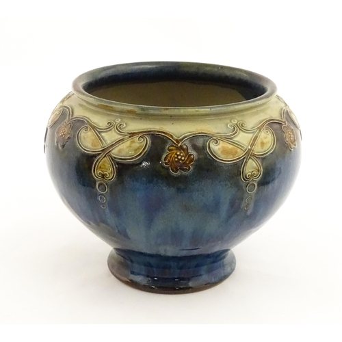 141 - A Royal Doulton stoneware vase / planter decorated with tube lined floral garlands. Marked under and... 