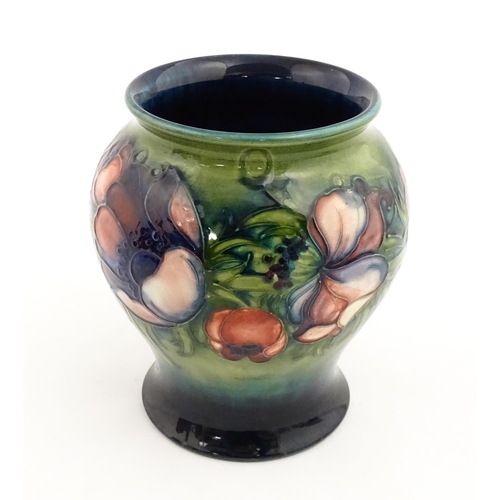 145 - A Moorcroft vase decorated in the Anemone pattern. Marked under. Approx. 6