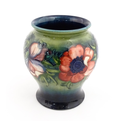 145 - A Moorcroft vase decorated in the Anemone pattern. Marked under. Approx. 6