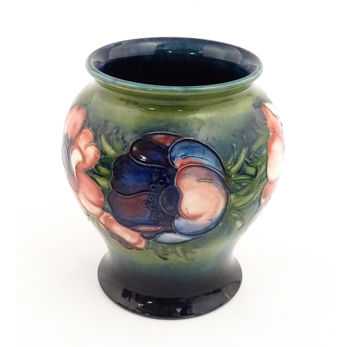 145 - A Moorcroft vase decorated in the Anemone pattern. Marked under. Approx. 6