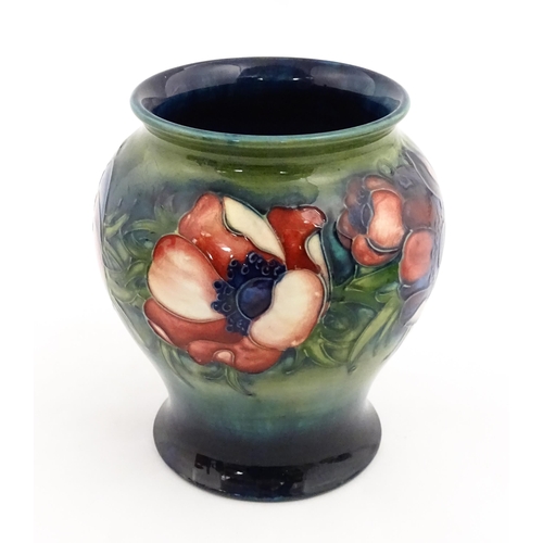 145 - A Moorcroft vase decorated in the Anemone pattern. Marked under. Approx. 6