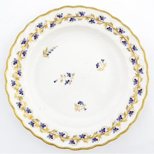 98 - A Derby plate decorated in the Cornflower pattern. Bearing puce mark under. Approx. 8 1/2