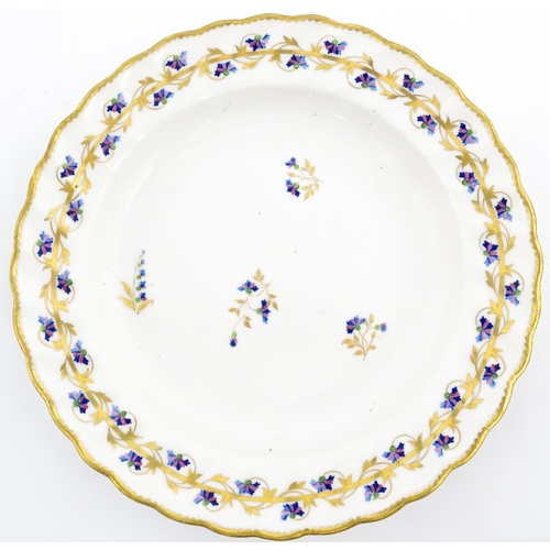 98 - A Derby plate decorated in the Cornflower pattern. Bearing puce mark under. Approx. 8 1/2