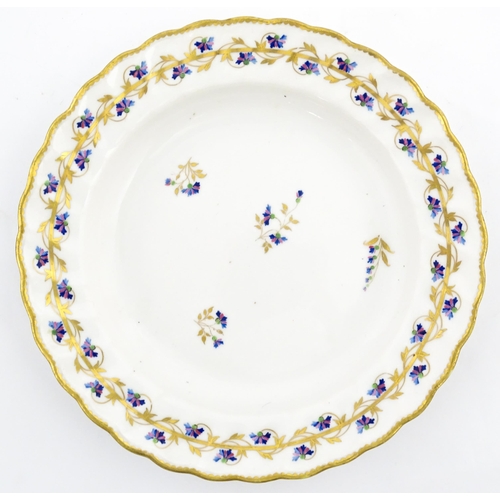 98 - A Derby plate decorated in the Cornflower pattern. Bearing puce mark under. Approx. 8 1/2