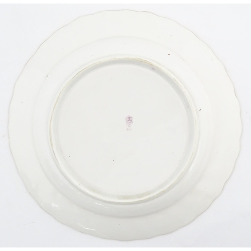 98 - A Derby plate decorated in the Cornflower pattern. Bearing puce mark under. Approx. 8 1/2