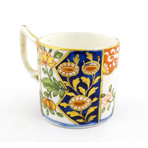 99 - A Derby coffee cup and saucer decorated in the Imari palette with flowers and foliage. Both pieces m... 