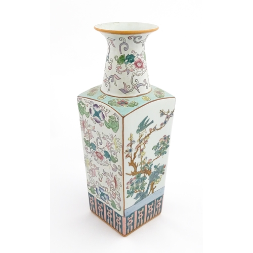 1 - A Chinese famille rose vase of squared form decorated with flowers, foliage and birds. Character mar... 