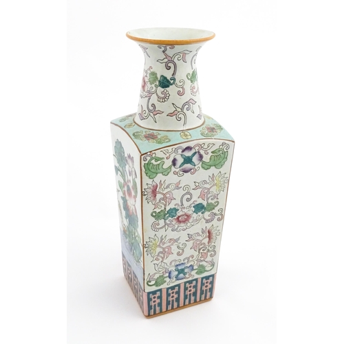 1 - A Chinese famille rose vase of squared form decorated with flowers, foliage and birds. Character mar... 